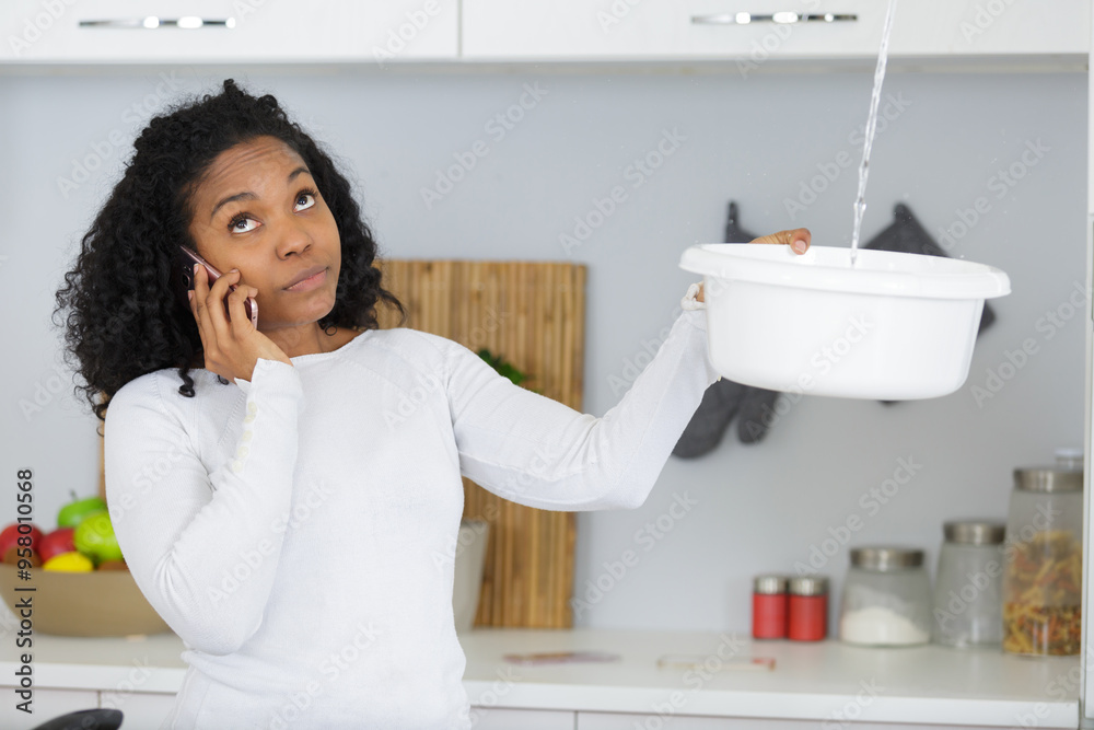 woman calling plumber to fix water leaking from ceiling woman calling plumber to fix water leaking from ceiling