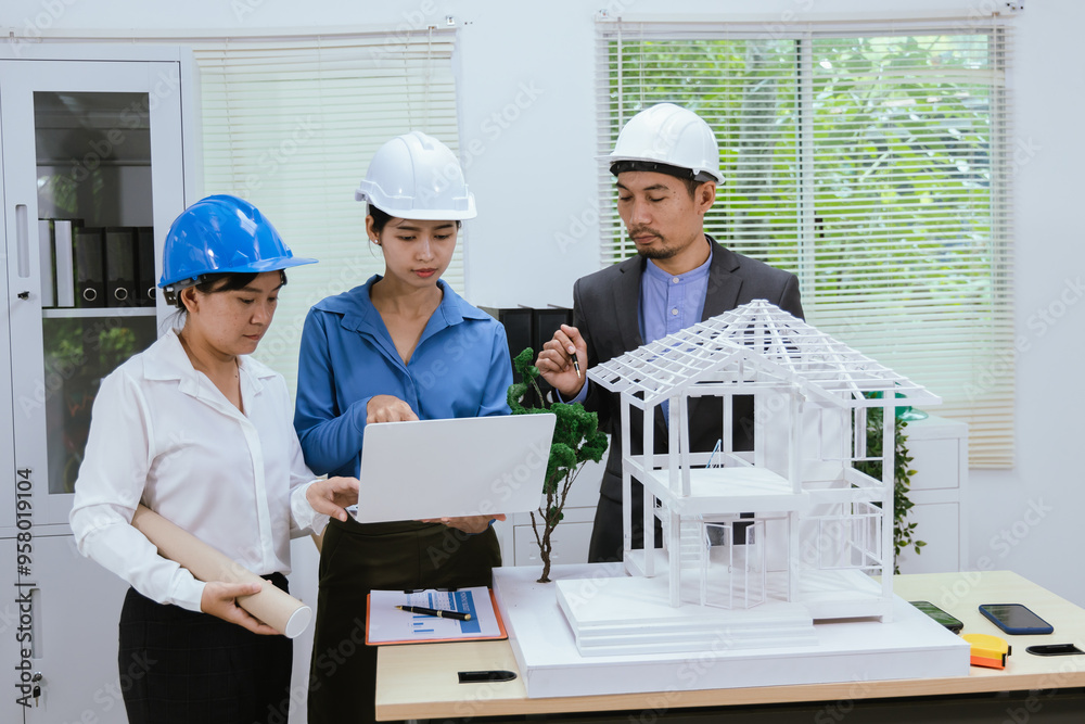 A team of architects and engineers work together in brainstorming sessions, discussing blueprints and construction plans for a real estate development. A team of architects and engineers work together in brainstorming sessions, discussing blueprints and construction plans for a real estate development.