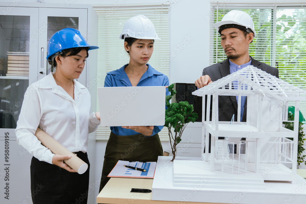 A team of architects and engineers work together in brainstorming sessions, discussing blueprints and construction plans for a real estate development.