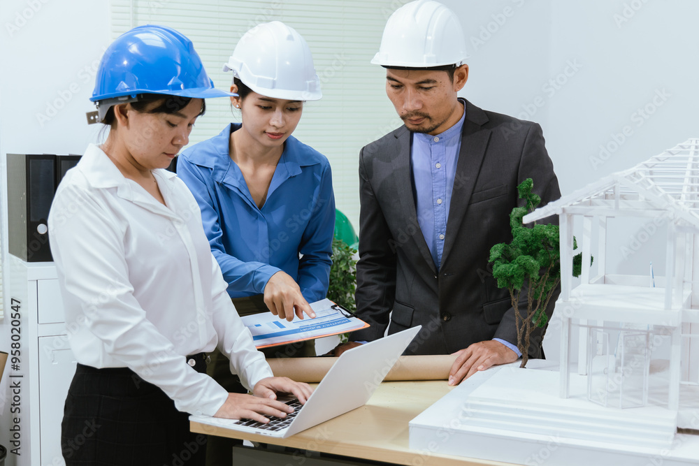 A team of architects and engineers work together in brainstorming sessions, discussing blueprints and construction plans for a real estate development. A team of architects and engineers work together in brainstorming sessions, discussing blueprints and construction plans for a real estate development.