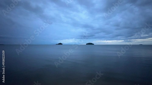 Deep blue sky and deep blue sea in the rainy season when it is raining.