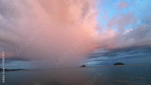 White clouds and orange sunlight on a rainy evening.