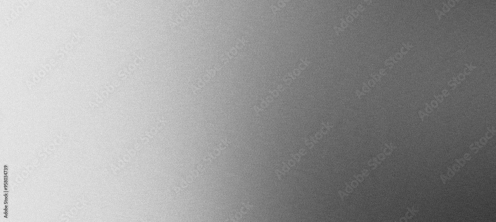 Subtle gradient fading from light to dark on a brushed metal texture background Subtle gradient fading from light to dark on a brushed metal texture background