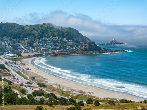 Aerial image of the Pacifica State Beach in Pacifica, California on a beautiful summer day with blue sky and blue water and a sandy beach photo