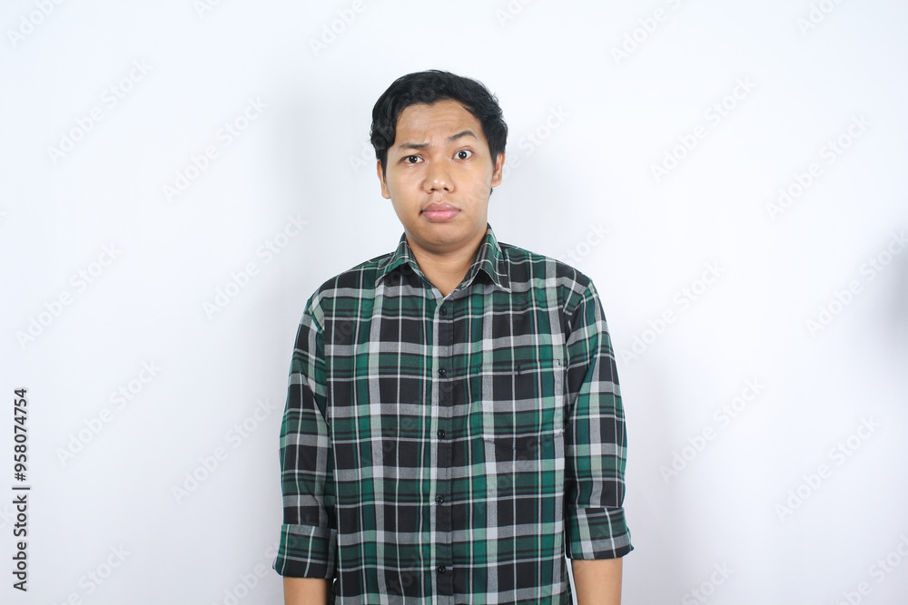 confused handsome asian young man standing over isolated background with blank stare wearing casual shirt confused handsome asian young man standing over isolated background with blank stare wearing casual shirt