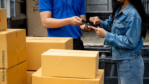 Delivery man asks customer to sign for package via mobile phone.