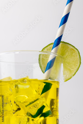 Yellow Lemonade in Vertical Frame with Ice and Lemon photo