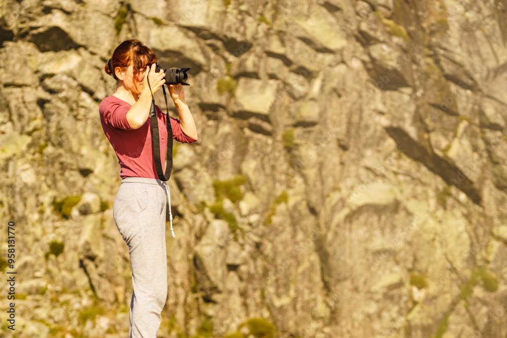 Woman with camera in mountains take travel photo Woman with camera in mountains take travel photo