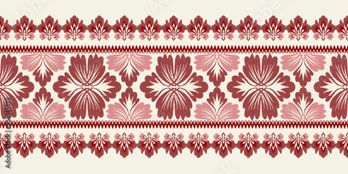 A linear ikat damask pattern in shades of red and pink, with detailed floral elements on a cream background. This border-style design adds a touch of elegance to fabric and wallpaper applications.