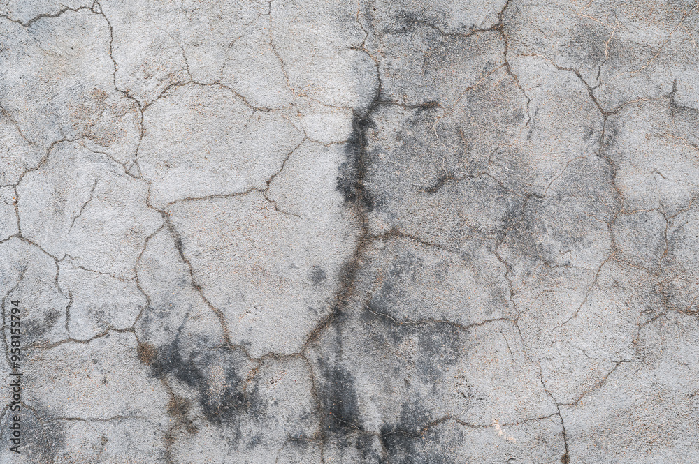 Fototapeta premium Weathered texture of concrete walls with cracks and plaster and stains.