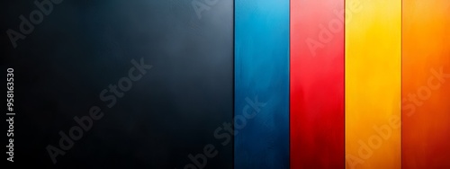  A tight shot of a multicolored wall against a black backdrop, featuring horizontal red, yellow, blue, and green bands