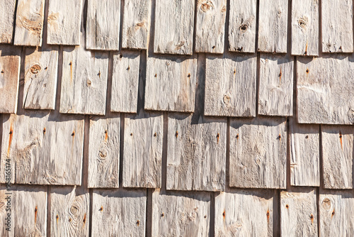 Obraz na płótnie Wooden background with a pattern of wood shingles, background with wood texture. Wooden wall showcasing the texture and natural imperfections of the wood w salonie