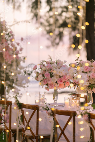 Dinner table decorated with beautiful flowers.