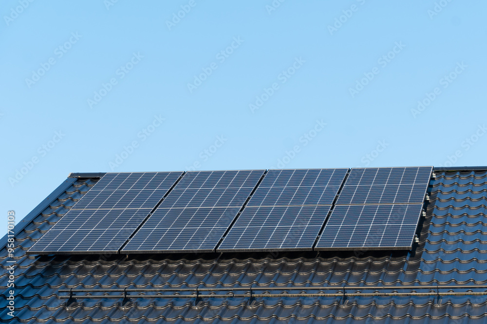 solar panels on home roof against blue sky solar panels on home roof against blue sky