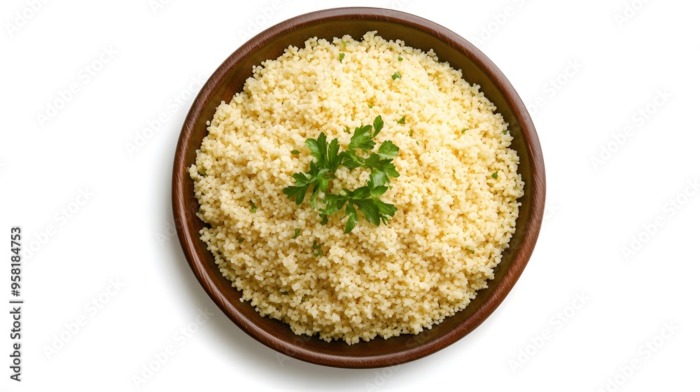 Freshly prepared couscous with parsley garnish in a wooden bowl Freshly prepared couscous with parsley garnish in a wooden bowl