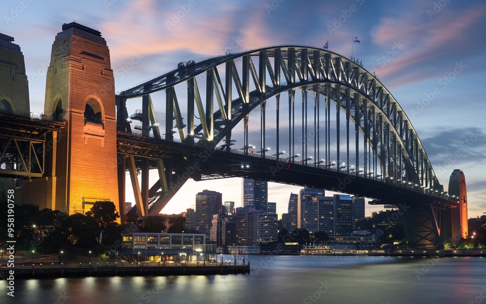 Fototapeta premium Sydney Harbour Bridge with City Skyline Sunrise Background
