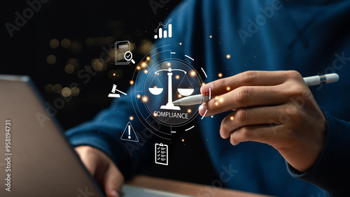 Compliance in business concept. Laws concept. Enforce laws, regulations and standards, comply with business policies, Businessman use laptop with compliance icon on virtual screen. photo