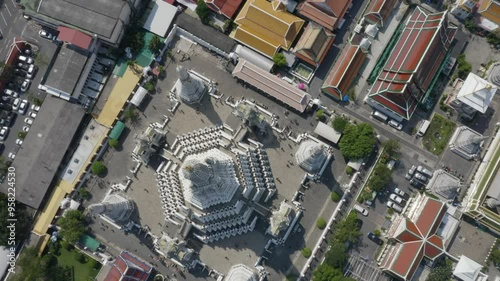 rising over wat arun in bangkok photo