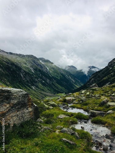 Hiking in Austrian Alps. Foggy day.