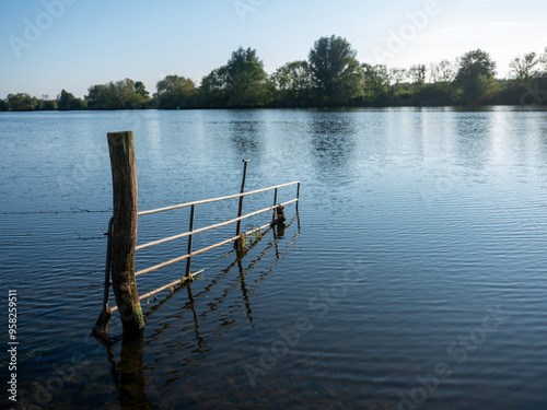 flooded gate in river maas near boxmeer in the netherlands photo
