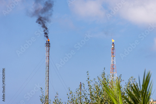 Fire from a gas torch in a large oil industry refinery factory in Skikda City, Algeria.