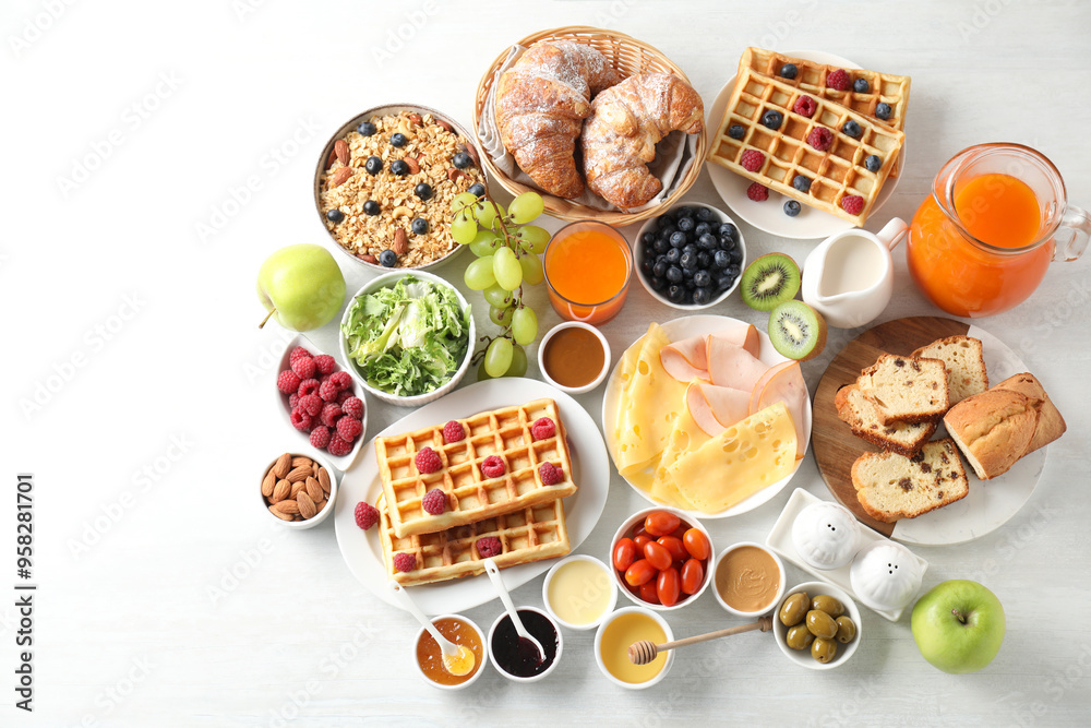 Different meals served for breakfast on white table, flat lay Different meals served for breakfast on white table, flat lay