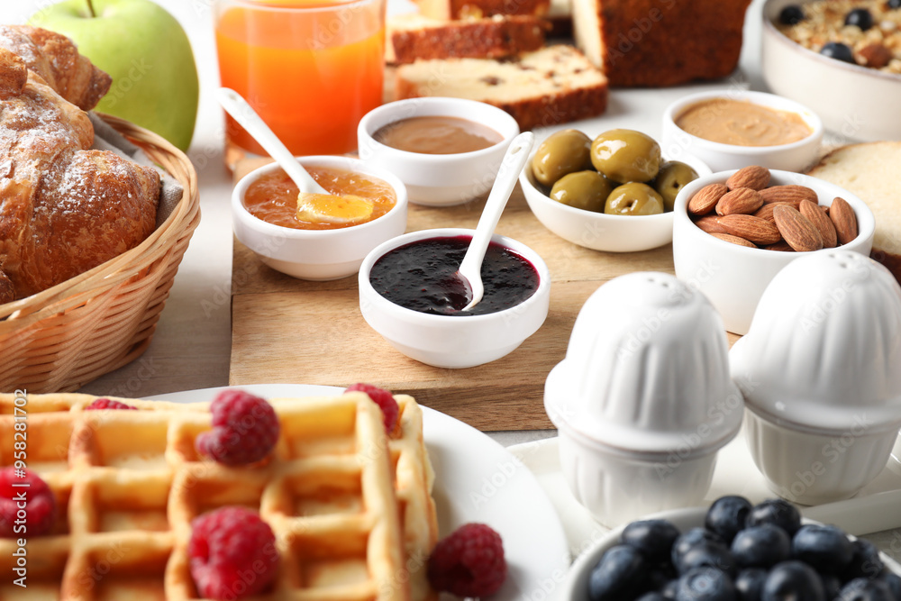Different meals served for breakfast on white table, closeup. Buffet menu Different meals served for breakfast on white table, closeup. Buffet menu