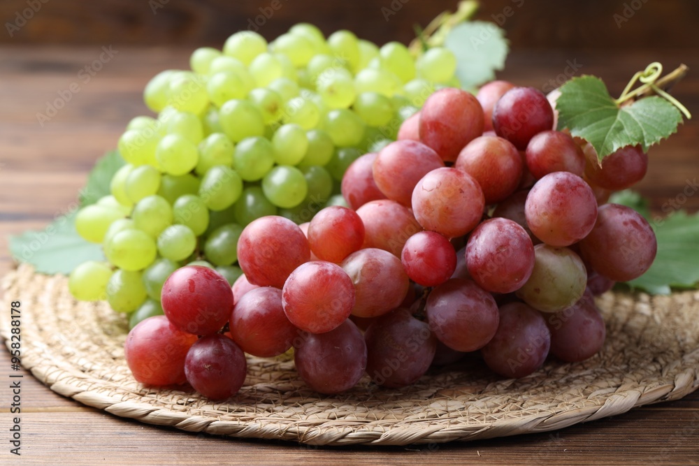 Fresh ripe grapes on wooden table, closeup Fresh ripe grapes on wooden table, closeup