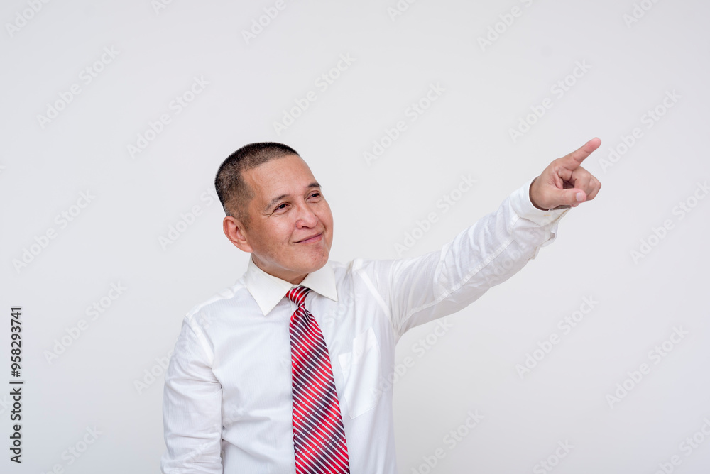 An ambitious middle aged office male professional visualizing company growth with an upward gesture of his finger. Set against a white background. An ambitious middle aged office male professional visualizing company growth with an upward gesture of his finger. Set against a white background.