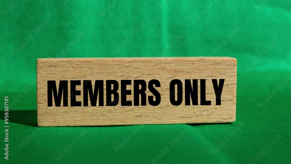Members only message writing on wooden block on green background. Conceptual members only symbol.