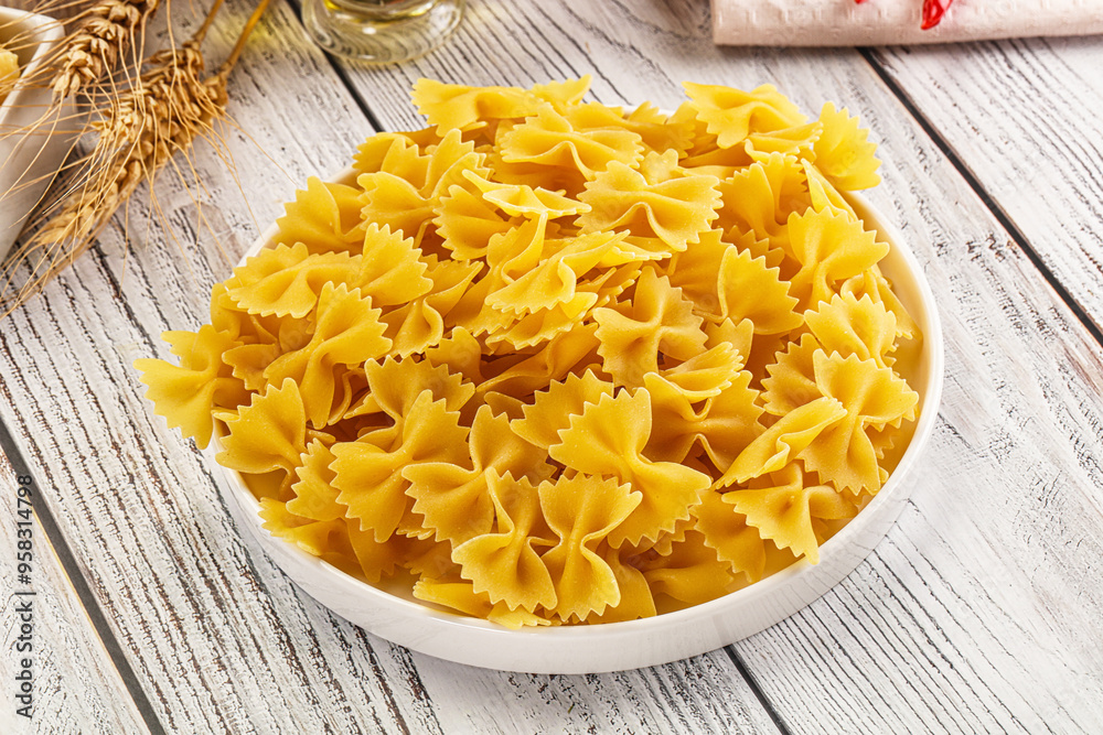 Raw dry Italian pasta - farfalle Raw dry Italian pasta - farfalle