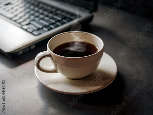 Relax during business work concept, americano coffee cup and black coffee cup aromatic and laptop computer in morning