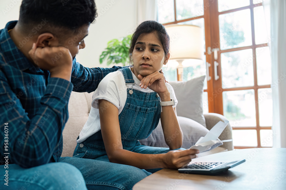 Stressed Couple Reviewing Bills and financial at Home, Dealing with Financial Stress and Budgeting Challenges Stressed Couple Reviewing Bills and financial at Home, Dealing with Financial Stress and Budgeting Challenges