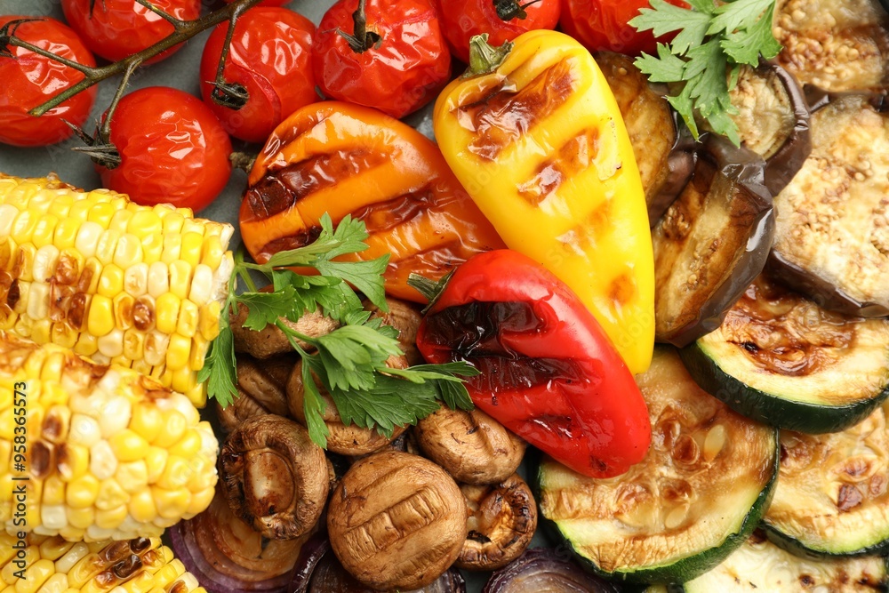 Delicious grilled vegetables on table, flat lay Delicious grilled vegetables on table, flat lay