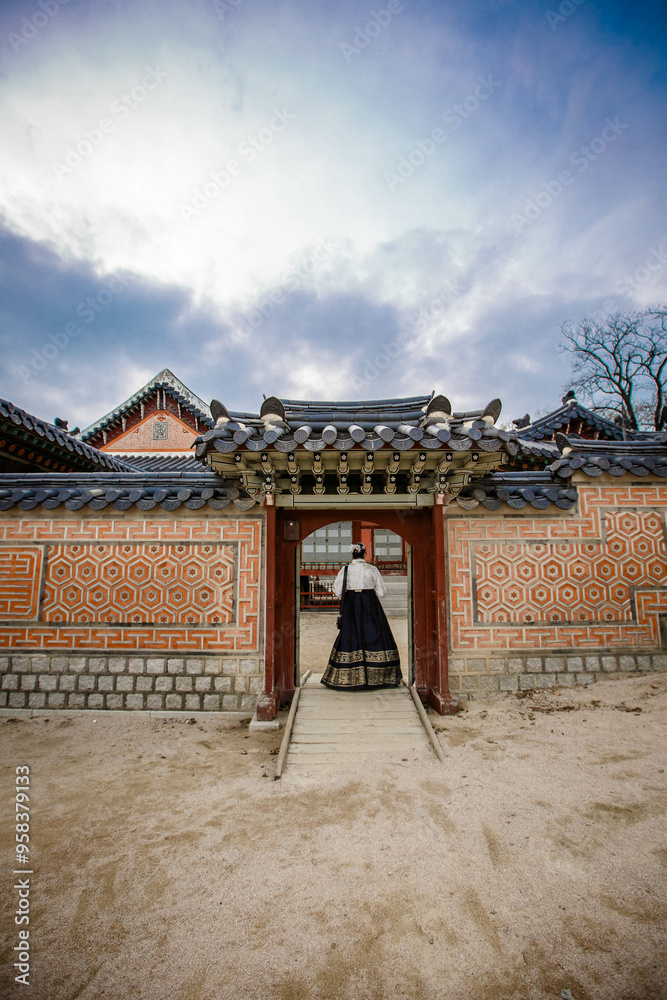 Tourists in national clothes walk in Gyeongbokgung Palace. Hanbok dress. South Korea