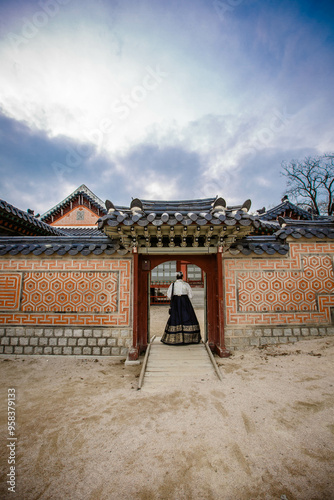 Tourists in national clothes walk in Gyeongbokgung Palace. Hanbok dress. South Korea 