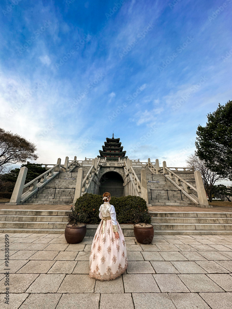 Tourists in national clothes walk in Gyeongbokgung Palace. Hanbok dress. South Korea