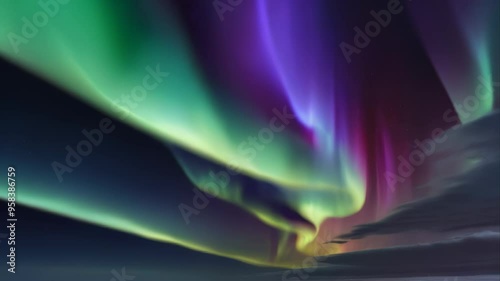 The northern lights shimmer in different colors in the night sky. natural phenomenon, sky flashes,light show