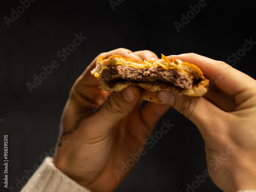 Chiken cheese burger with bacon on black background photo