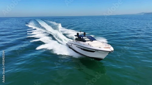 Aerial view of a yacht sailing at full speed