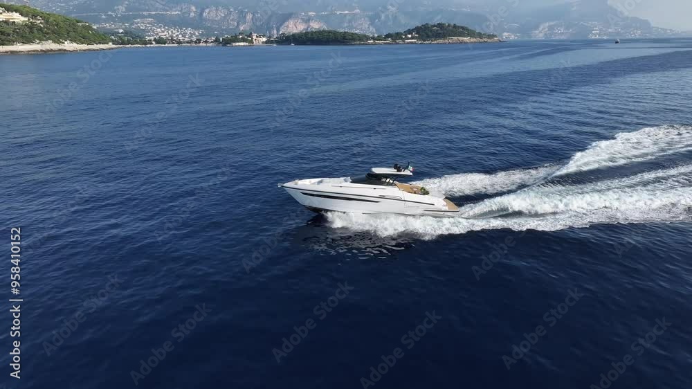 Aerial view of a yacht sailing at full speed Aerial view of a yacht sailing at full speed