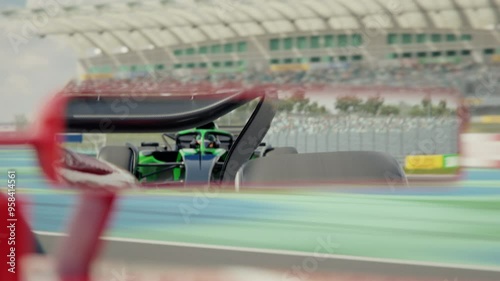 Wallpaper Mural Close-up of the rear view mirror of ageneric formula one race car showing the chasing race car. 3d animation rendering Torontodigital.ca