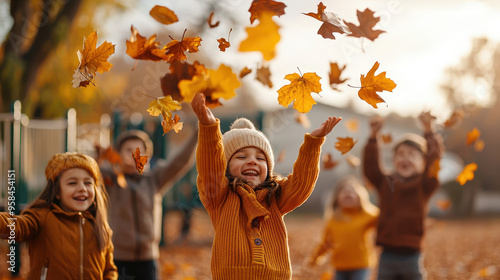 Joyful children playing in autumn, tossing orange leaves into the air in a park setting. A perfect fall day.