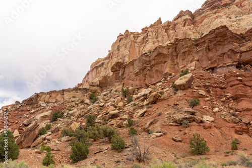 A cloudy and sunny view of red rocks at Capitol Reef National Park in Utah.