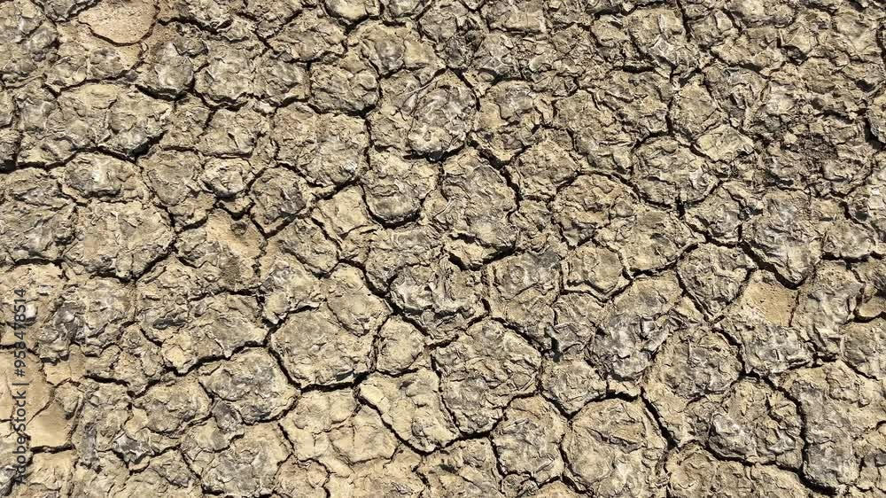 Close-up of dried out cracked soil of a salt marsh Close-up of dried out cracked soil of a salt marsh