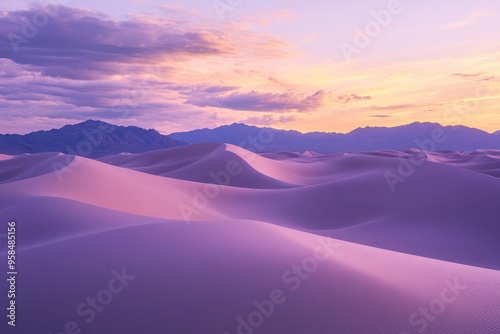 A serene desert landscape at sunset with soft, rolling sand dunes and distant mountains.