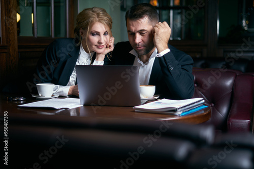 Business people talking over coffee in cafe