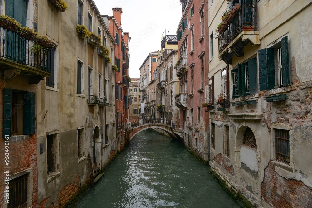 Serene Venetian canal flanked by historical buildings Serene Venetian canal flanked by historical buildings