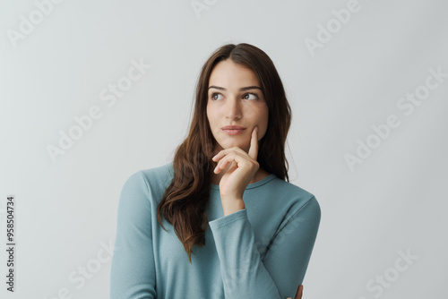 Attractive woman posing with hand on chin