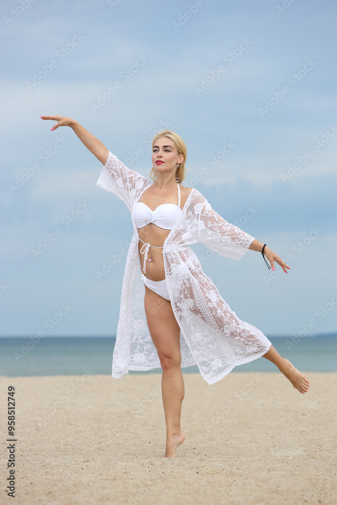 young woman in white swimsuit on the beach young woman in white swimsuit on the beach